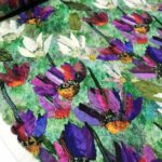 Tissu jersey viscose Fleurs - fond vert multicolore