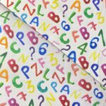 Tissu coton imprimé Bio Certifié GOTS Alphabet - Multicolore, fond blanc