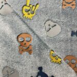 Tissu Doudou imprimé Skull - Jaune, orange, bleu, fond gris