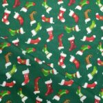 Tissu coton imprimé chaussette de noël - Fond vert