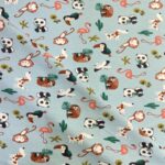Tissu jersey imprimé enfant - Koala, singe et toucan, fond bleu ciel