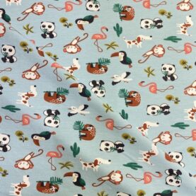 Tissu jersey imprimé enfant - Koala, singe et toucan, fond bleu ciel