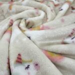Tissu Doudou imprimé - Licornes, fond naturel