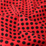 Tissu Crêpe à Pois Noir - Fond Rouge